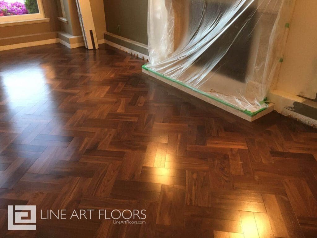 Polished wooden parquet floor with intricate geometric patterns.